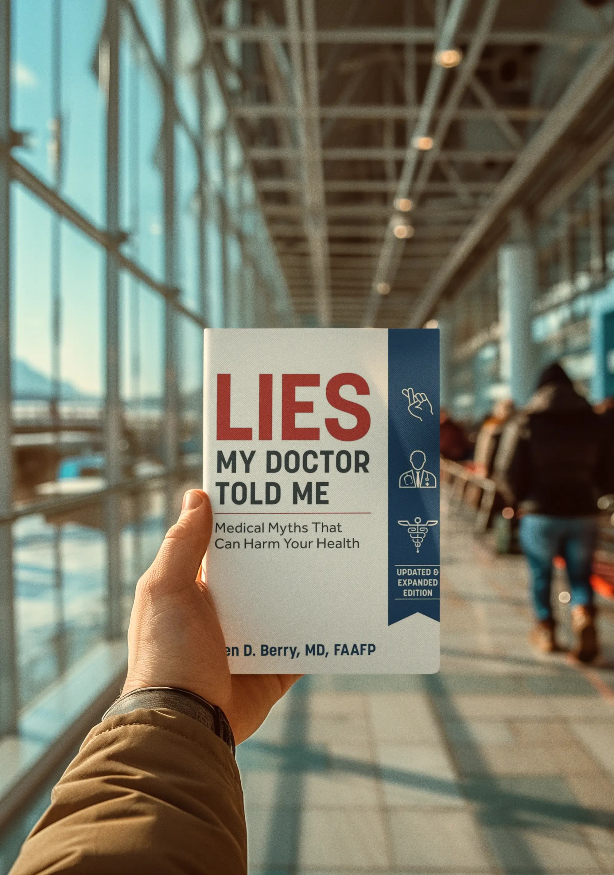 Dr. Ken Berry holding his book